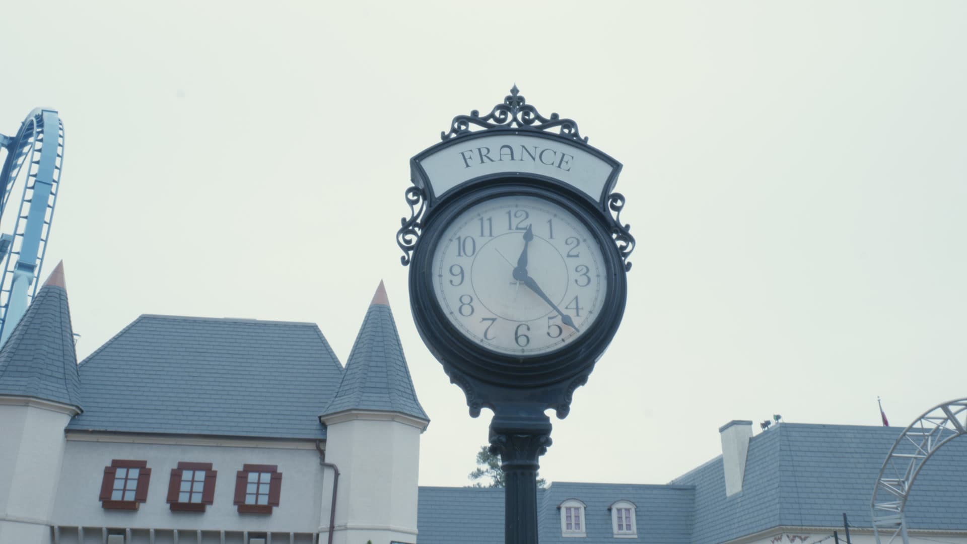 An ornamental clock above the rooftops at Busch Gardens Williamsburg